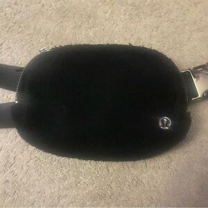 Black Sherpa belt bag with silver hardware